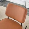 PU material cushioned rocking chair, unique rocking chair, cushioned seat, brown backrest rocking chair, black metal legs. Comfortable side chairs in the living room, bedroom, and office