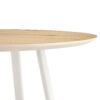 A modern and minimalist circular dining table with a 42 inch diameter wood colorer patterned tabletop and white metal legs. Suitable for restaurants, living rooms, and conference rooms.