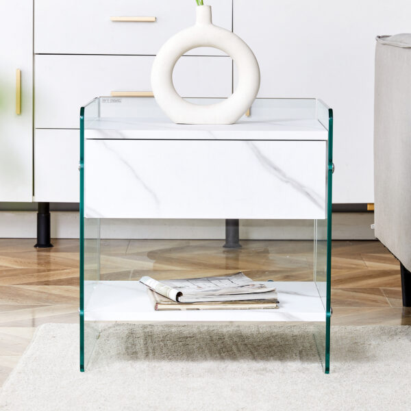 c9ab6f494be84944be052e8c79831a8e_1b205fd12e6c345273fa4b74f81f21d4 Bedside table with drawers. The board surface is MDF sticker, and both sides are transparent tempered glass. The design is simple and elegant, with excellent storage functions.