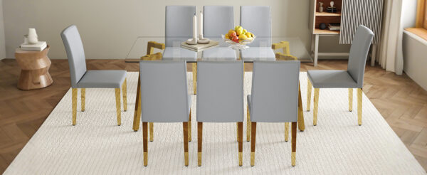 c9f49bf676f94d5792690bf19f6923fe_caa78e198688ec5192b25e0a876ebc20 Table and chair set.71 * 35.4 inch rectangular dining table.Tempered Glass Tabletop,Golden 7-shaped Metal Table Legs.Paried With 8 Light Gray PU dining chairs, Golden Metal Legs.Simple and versatile.
