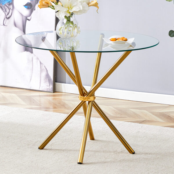 cc54754bb6cf469a8ce886c5eff49071_8ee35bc74b15531a56bb28041c45bf0e Round clear glass dining table with a unique shape for 4-6 people, with ring-shaped gathered gold metal legs, suitable for desks, kitchens, terraces, dining rooms.