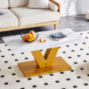 Modern minimalist coffee table. Tempered glass with stickers tabletop,golden MDF pillars. Suitable for living room and dining room
