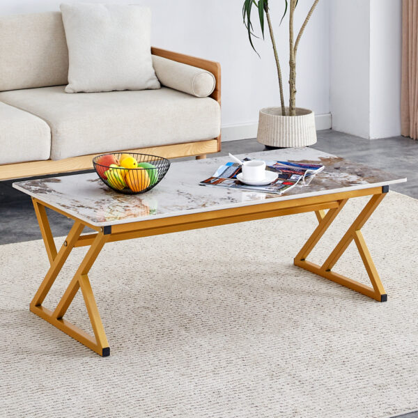 d2a928656df048ceaab5a5bae2a8b3c9_0a1881d7937301bffaf0c99ba341f365 A coffee table is made of rock slab material, with a natural and smooth marble pattern on the surface, which complements the modern design of the golden metal legs and adds a touch of fashion.47*23.6