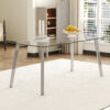 71 * 35.4 inch rectangular dining table. The transparent tempered glass tabletop is paired with silver 7-shaped metal table legs, showcasing a minimalist texture. Suitable for various places.
