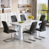 Table and chair set.64.5 x 35.4 Inch Stylish White Marble Textured Dining Table,Perfectly Blending Simplicity And Transparency.Paried With 6 Black High-quality PU Chairs With Silver Arched Metal Legs.
