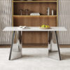 63"x31.5x30" Luxurious Snow Mountain Stone Sintered Stone Dining Table with Silver Stainless Steel Butterfly Legs.The tabletop is designed to be scratch and heat resistant.