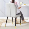 4 light gray modern dining chairs with stylish PU patterned backrest and black metal legs for a comfortable home experience in the kitchen, bedroom and office.