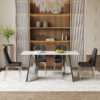 Table and chair set.63"x31.5x30" Luxurious Snow Mountain Patterned Sintered Stone Table with Silver Metal Butterfly Legs.Paired With 4 Black Chairs With Silver Metal Legs.Modern Light Luxury.