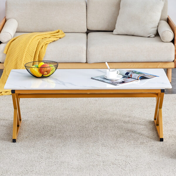 e0823d1a518e4d49bcb6980eb993ac54_21c929eb4fa7b1395d82c9d714da1e31 A coffee table made of rock slab material, with a smooth and natural surface that complements the modern design of the golden metal legs, making it suitable for living rooms of all sizes.47*23.6
