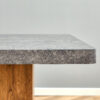 Large modern rectangular table with cement-grey patterned top and large MDF legs for kitchen, dining and living room to give a different atmosphere to the home environment.