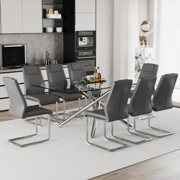 e21a25321ab840e3bfa73f3c9e0e65c2_5060d510f62d92b123496709e5d8877a Table and chair set.Modern Luxurious Transparent Tempered Glass Dining Table Set with 8 Chairs.Single fork silver metal table legs.Dark gray high-quality PU dining chairs with silver metal legs.