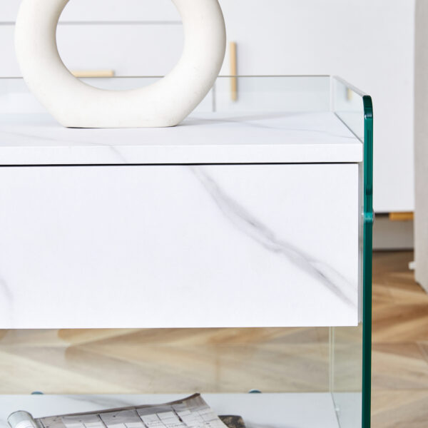 e27eb40bf3dc4565ad70e52362e779d8_3bc6c396fa41509f19022e5ed3bc139d Bedside table with drawers. The board surface is MDF sticker, and both sides are transparent tempered glass. The design is simple and elegant, with excellent storage functions.