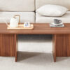 44.8 Inch Walnut Wood Grain MDF Coffee Table - Modern Luxury, Stable Triangular Support.The coffee table is made of medium density fiberboard material and is suitable for living rooms, bedrooms,etc.