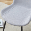 Table and chair set.A minimalist retro rectangular dining table with a textured top and black metal legs.Paired With 4 Light Gray Linen-Cotton Dining Chairs With Curved Widened Cushion Design.