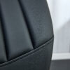 Four black dining chairs. A medieval modern chair made of PU material with soft cushions, equipped with golden metal legs. Suitable for restaurants and living rooms