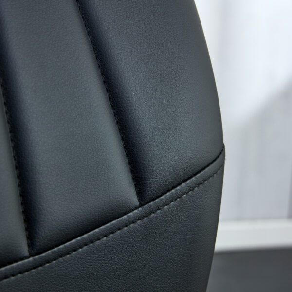 ec45e8ac19e4400cb8d7203ad97e14f2_20240205_deaf22142dbfbf94ddebfe676dca61ce Four black dining chairs. A medieval modern chair made of PU material with soft cushions, equipped with golden metal legs. Suitable for restaurants and living rooms
