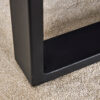 A rustic gray wood grain MDF coffee table with black metal legs - an elegant space in natural wood tones