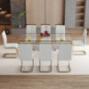 Table and chair set.Elegant Transparent Tempered Glass Dining Set - 71"x35.4" with 8 Light Gray PU Chairs with golden C-tube metal leg.X-shaped Golden Metal Table Legs,Black Textured MDF Crossbeam.