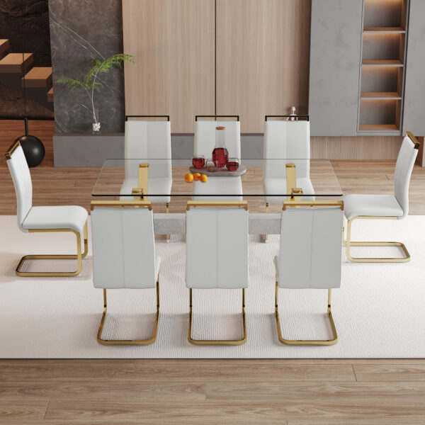 f10611758d1048158730796bca48082e_515f2f551ca3b4bb0634dc6d2fff0f4d Table and chair set.Elegant Transparent Tempered Glass Dining Set - 71"x35.4" with 8 Light Gray PU Chairs with golden C-tube metal leg.X-shaped Golden Metal Table Legs,Black Textured MDF Crossbeam.