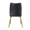 Four black dining chairs. A medieval modern chair made of PU material with soft cushions, equipped with golden metal legs. Suitable for restaurants and living rooms