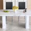 Table and chair set.64.5x35.4 Inch Stylish White Marble Textured Dining Table.Paried With 4 Black PU dining chairs, Silver Metal Legs.Simple and versatile.High Elasticity Sponge Filling.