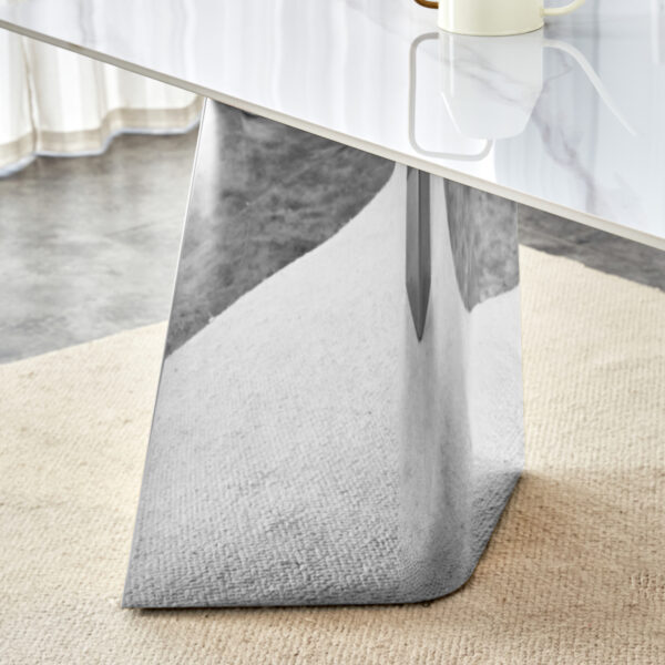 f3ed381d19cc4375b2e655ddd0e8f268_b59b0b3fef122f5cb1bde45e2ee3c64d 63"x31.5x30" Luxurious Snow Mountain Stone Sintered Stone Dining Table with Silver Stainless Steel Butterfly Legs.The tabletop is designed to be scratch and heat resistant.