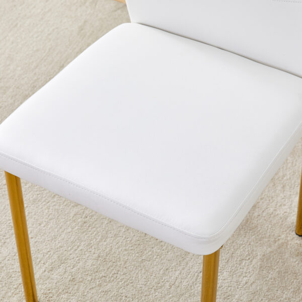 f5edf67cee1144389538d515d926214d_1899592ddb4d172fd3ea3685ddd28276 Luxury Simple Chair - Set of 4 White PU Material High Resilience Dining Chair with Metal Gold Leg.The Chair Back Has a Vertical Stripe Design With Smooth And Uniform Lines.