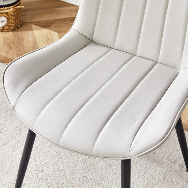 f65a53363e9d46efb8ea4ad0b8d0f767_cb88f9cd4f890584e756c683209a5d84 Extended Seat Cushion PU Dining Chair Set - Four Pieces,Ergonomic Design.Smooth line design,Integral metal leg structure,Can integrate well into various modern home decoration styles.