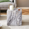 Elevate your living space with this modern MDF coffee table, which showcases gray textured patterns. It is characterized by stylish design.
