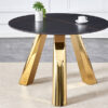 The 42-inch stainless steel gold-plated flamed granite round table with seating for 4 or 6 people is perfect for dining, entertaining, or as a conference table