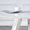 A 42-inch stainless steel leg round table with a marble top is suitable for use by four or six people
