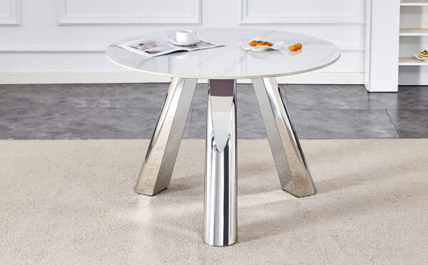 53ba44ede89a4a12b2e0ec0d1071f8ac_fd8a814345f04c906c6a708664c818eb A 42-inch stainless steel leg round table with a marble top is suitable for use by four or six people