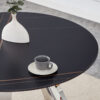 A 42-inch burn stone round table with stainless steel legs can accommodate 4 or 6 diners
