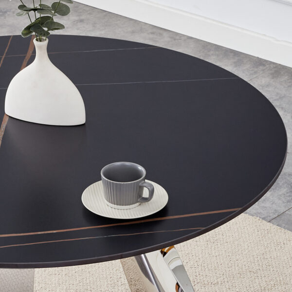 5f6337a848c3479bac9605ded3dc3bdd_08eaedde7405d88a6e64f0d13ad5fe2b A 42-inch burn stone round table with stainless steel legs can accommodate 4 or 6 diners