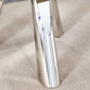 A 42-inch stainless steel leg round table with a marble top is suitable for use by four or six people
