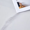 A 42-inch stainless steel leg round table with a marble top is suitable for use by four or six people