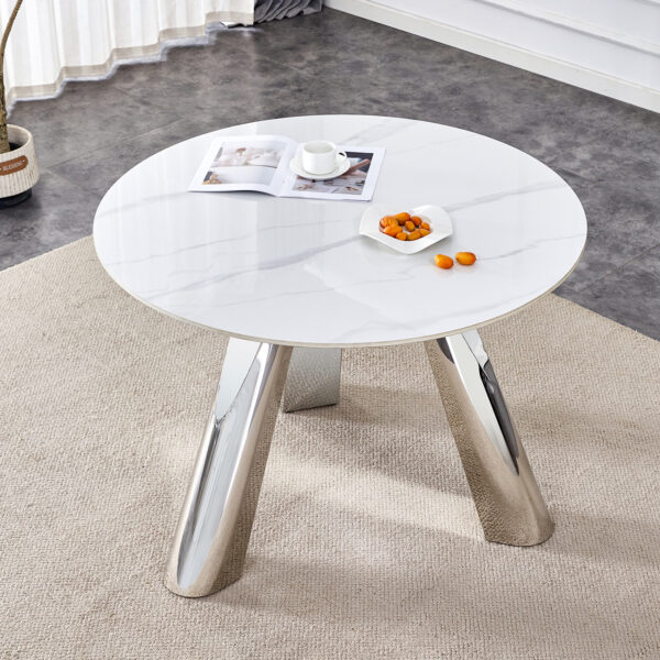 990cce43bb694517a75e1988b148011a_5b1ddf652c71544a4422a91181fff281 A 42-inch stainless steel leg round table with a marble top is suitable for use by four or six people