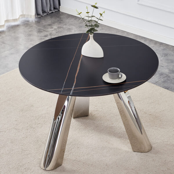 d03326803210441c8e22395904df6fc2_1e85e1c1997af2f28d6c6a1b7803cefe A 42-inch burn stone round table with stainless steel legs can accommodate 4 or 6 diners